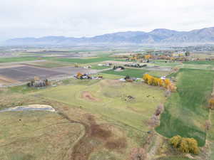 Aerial overview of property's location with a mountain backdrop and rural landscape