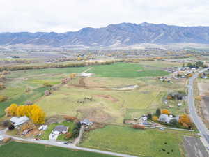 Aerial view of property and surrounding area with mountains