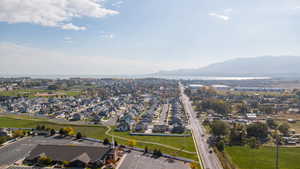 Aerial view of residential area featuring a water and mountain view