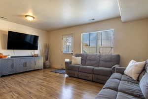Living room with wood finished floors and baseboards