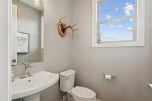 Bathroom featuring a sink and toilet