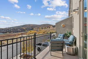 Balcony with a residential view and a mountain view