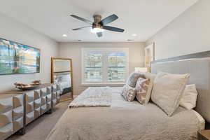 Bedroom featuring carpet flooring, ceiling fan, and recessed lighting