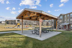 View of home's community featuring a residential view, a yard, and a patio area
