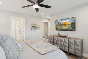 Carpeted bedroom featuring recessed lighting and ceiling fan