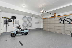 Garage featuring a garage door opener