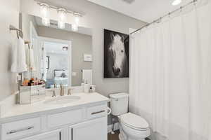 Full bathroom with vanity and recessed lighting
