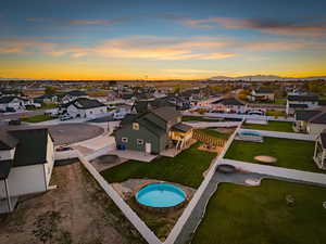 Aerial view of residential area featuring a pool
