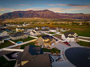 Aerial perspective of suburban area with a mountain backdrop