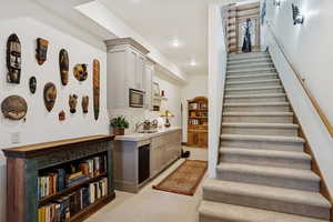Stairs featuring carpet floors and recessed lighting