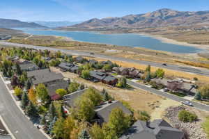 Aerial perspective of suburban area featuring a water and mountain view