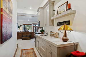 Hallway featuring light carpet and recessed lighting