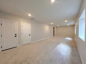 Basement featuring recessed lighting and carpet flooring
