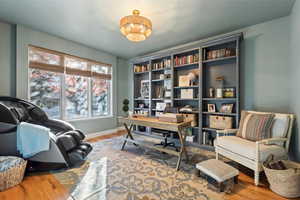 Office area with wood finished floors and baseboards