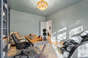 Office space with wood finished floors and baseboards