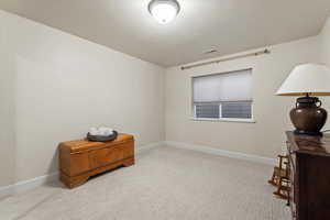 Office space featuring light colored carpet