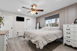 Bedroom featuring light wood-style floors, recessed lighting, and a ceiling fan