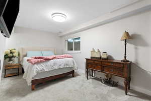 Carpeted bedroom with baseboards