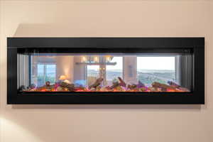 Detailed view of custom see-through fireplace in home office/study.