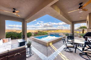View of patio / terrace featuring ceiling fan, outdoor dining space, a pool with connected hot tub, and a grill