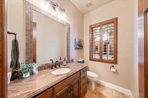 Bathroom featuring vanity and light tile patterned floors