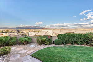 Fenced backyard with a mountain view