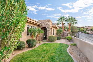 View of side yard with a gate