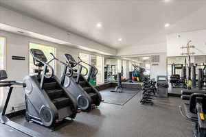 Club House Workout area featuring recessed lighting and vaulted ceiling