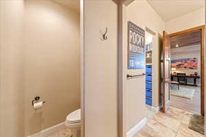 Guest Suite Bathroom with baseboards and light tile patterned flooring