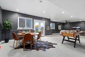 Playroom featuring carpet floors, plenty of natural light, recessed lighting, french doors, and a ceiling fan