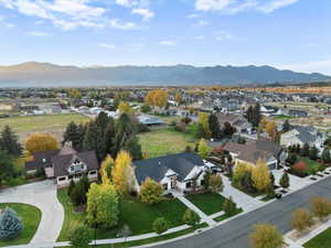 Aerial view of residential area featuring a mountainous background