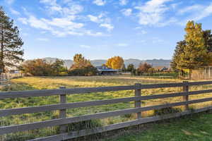 View of yard featuring a mountain view and a view of countryside
