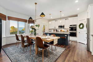 Dining space featuring recessed lighting and dark wood finished floors