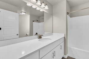 Full bathroom featuring vanity and tub / shower combination