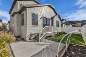 Back of property with a patio and a mountain view