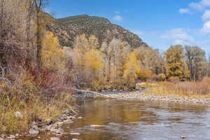 View of mountain backdrop with a nearby body of water