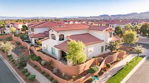 Aerial view of residential area featuring mountains