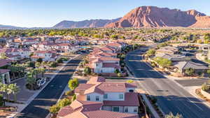 Aerial perspective of suburban area featuring a mountainous background