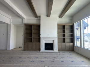 Living room with stained beams and build-ins