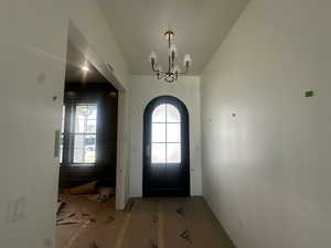 Foyer featuring a chandelier and arched walkways
