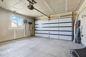 Garage featuring a garage door opener