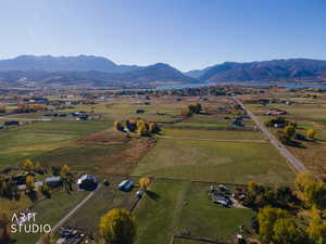 View of property location featuring rural landscape and a water and mountain view