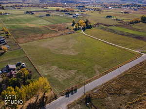 Aerial view of property and surrounding area featuring rural landscape
