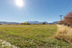 View of mountain background featuring rural landscape