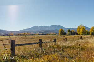 View of mountain backdrop featuring rural landscape