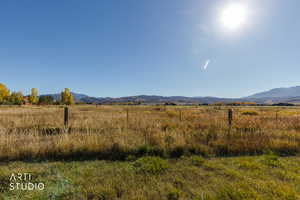 View of mountain background featuring rural landscape