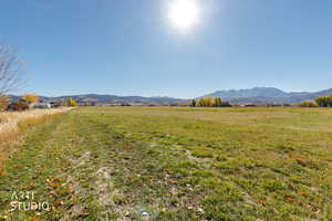 View of mountain backdrop featuring rural landscape