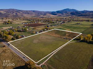 View of rural area featuring mountains and property parcel outlined