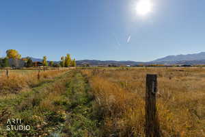 View of mountain background featuring rural landscape