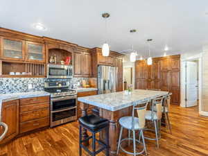 Beautifully remodeled kitchen with a large center island, stainless appliances, double ovens and tons of cabinets for storage